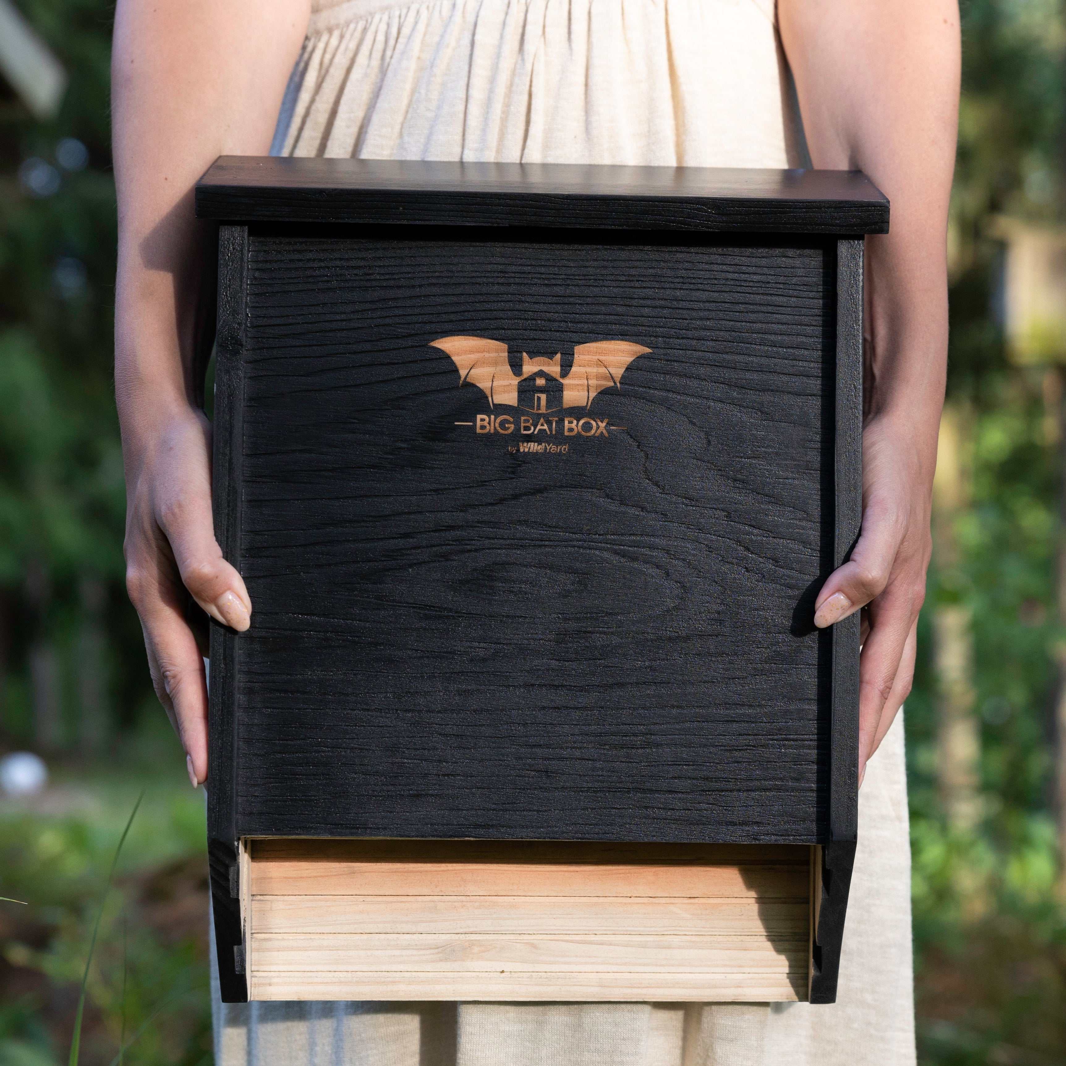 Eco-friendly two-chamber black cedar bat house for natural pest control and safe roosting